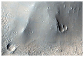 Knobs and Platy Flows near Tartarus Colles