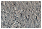 Cross-Section Through a Long Alba Patera Lava Flow Provided by a Graben