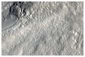 Crater with Intersecting Faults in Tempe Terra