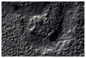 Possible Hydrated Mineralogy on Eudoxus Crater Rim