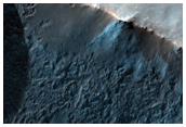 Crater in Daedalia Planum with Layered Mantle