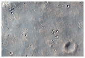 Wrinkle Ridge and Impact Crater Intersection