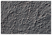 Valley and Surrounding Plains in Northern Aonia Terra