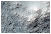 Possible Compositional Variations in Sirenum Fossae