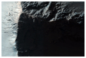Tilted Block at Coprates Chasma and Debris Flows