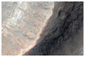Layers Exposed in Wall of Crater in the Floor of Hydaspis Chaos