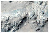 Pits on Fan Surfaces in Mojave Crater
