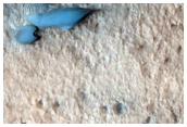 Possible Olivine-Rich Terrain Within Lyot Crater