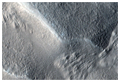 Channel in Mamers Valles Crater with Possible Phyllosilicates