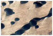 Aeolian Interaction with Gemini Scopuli Layered Deposits