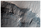 Impact Crater Teetering on the Edge of a Canyon