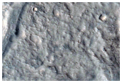 Shallow Channel Cutting through a Crater in CTX Image