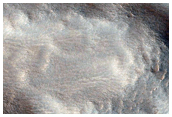 Northern Plains Landforms and Ejecta From Youthful Crater
