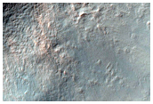 Small Fresh Crater on Floor of Larger Crater