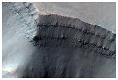 Rampart Crater Ejecta Exposed in Cross-Section
