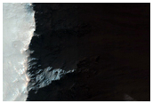 Tilted Block at Coprates Chasma and Debris Flows