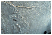 Central Structure and Layering of a Large Impact Crater