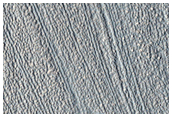 Discontinuity in Lineations on Surface of Valley Floor Material