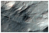 Impact Crater Exposing Bedrock in Thaumasia Planum