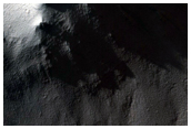 Exposed Layers and Impact Crater Cut by Depression Wall