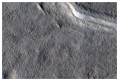 Impact Crater and Plains North of the Acheron Fossae Region