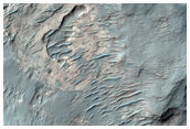 Light-Toned Rock Outcrops in Depression Northeast of Buta Crater