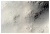 Channel Entering Crater near Dichotomy Boundary