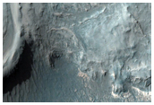 Valley Features and Light-Toned Deposits along Melas Region Southern Wall