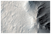 Layered Materials and Blocks in Olympus Mons Aureole