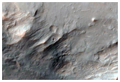 Impact Crater Exposing Bedrock in Thaumasia Planum