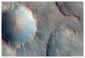 Circular and Elliptical Mounds with Large Depressions