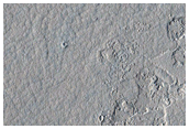 Decameter-Scale Patterned Ground and Possible Pits