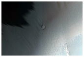 Possible Phyllosilicates Associated with Crater on Rim of Huygens Crater