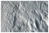 Complex Pedestal Crater on Ejecta Blanket of Larger Crater