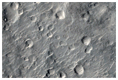 Breach in Rim of Eroded Impact Crater