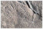 Depression West of the Auqakuh Vallis Terminus in Nilosyrtis Mensae