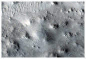 Central Uplift of a Crater near Dichotomy Boundary