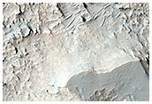 Pit on Floor of Niesten Crater that Exposes Layered Deposits