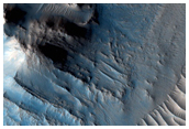 Well-Preserved Impact Crater with Central Uplift and Glacial Flow Features