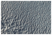 Dissected Mantle in Alexey Tolstoy Crater Rim