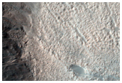 Volatiles and Gullies in Avire Crater