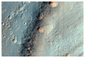 Streamlined Form Surrounded by Pitted Materials in Hale Crater