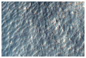 Tongue-Shaped Flow Feature on Mound East of Hellas Region