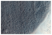 Fresh Impact Crater with Gullies and Bedrock