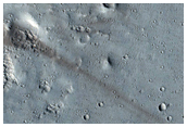 Well-Preserved 15-Kilometer Diameter Crater near Alba Mons