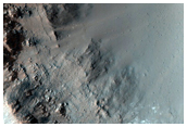 Crater on Floor of Huygens Crater with Possible Olivine