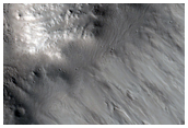 Well-Preserved Impact Crater on Phlegethon Catena