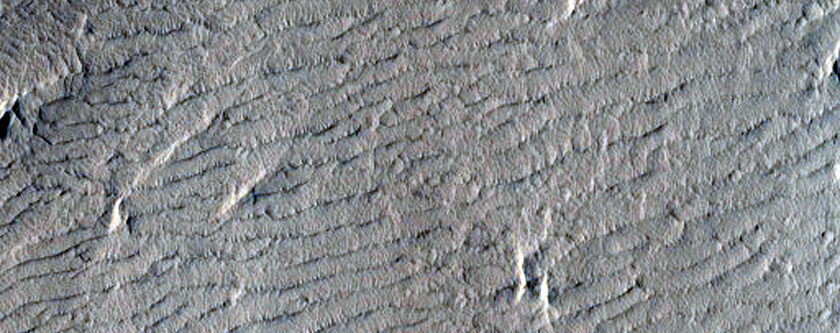 Dark Materials on Block in Olympus Mons Aureole