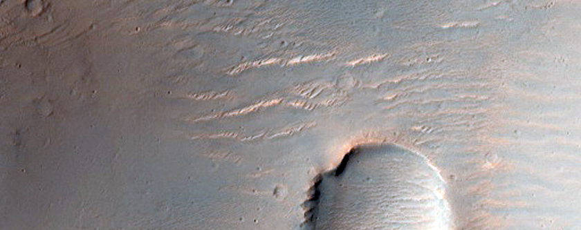 Crater Intersected by Valleys East of Huygens Crater