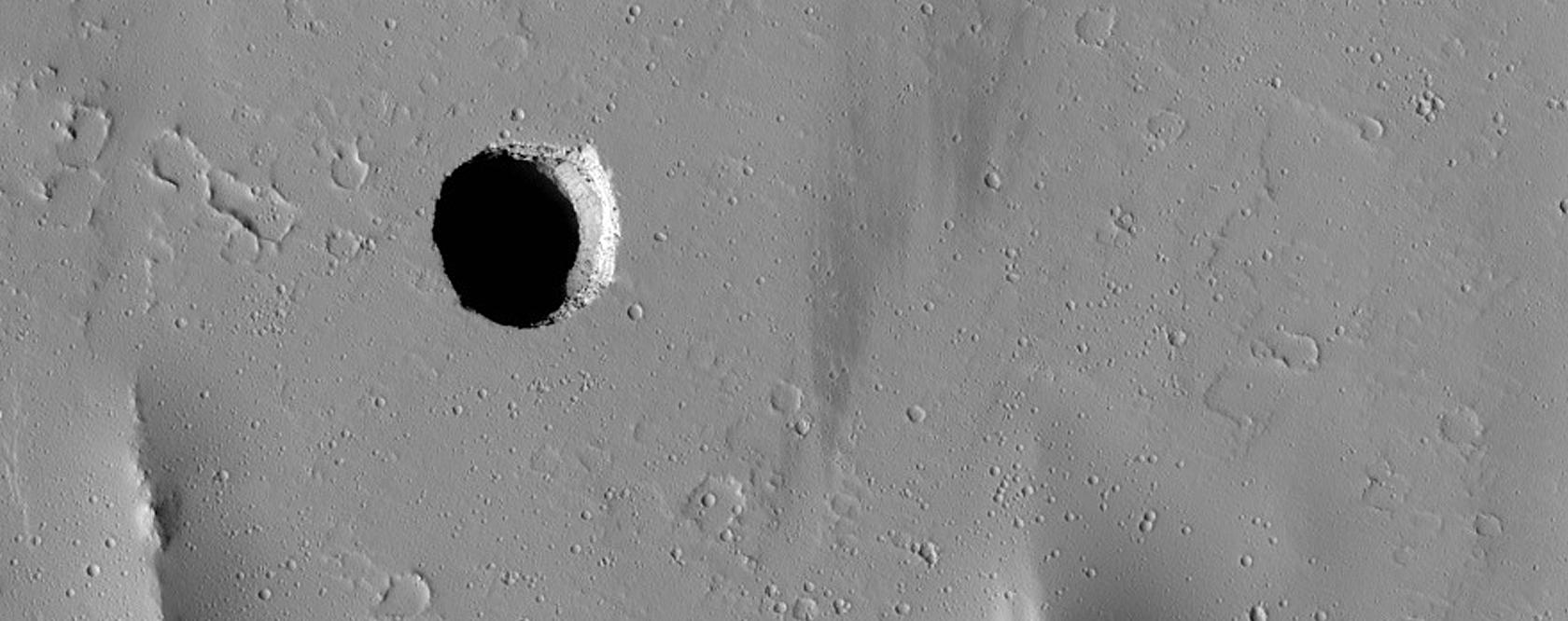 Collapse Pit in Tractus Fossae